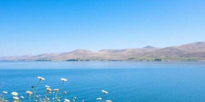 Calm landscape with gentle hills and clear waters.